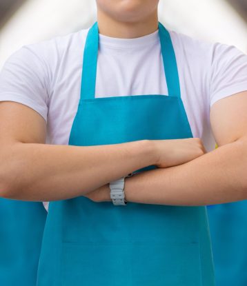 Group of cleaners standing on blurred background. Concept cleaning service.